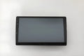 Black 10.1 inch Android car head unit with touch screen display showing navigation interface