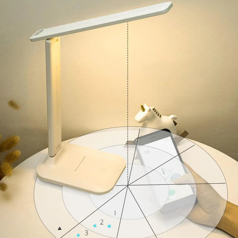 White plastic children's bedside lamp with touch dimming controls and USB charging port
