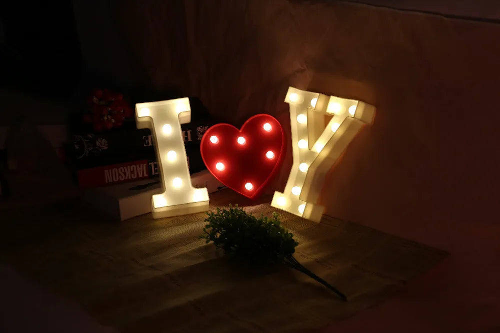 White plastic LED marquee letter sign with warm white glow, 22cm tall