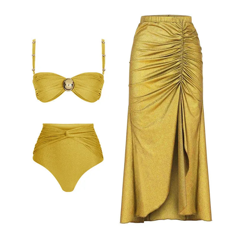 Women's yellow and green split bikini swimsuit set with high waist trousers and a wrap skirt laid flat.