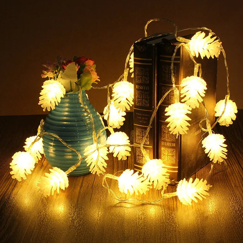 Warm white battery-operated LED pine cone string lights for decoration, showing plastic shell design.
