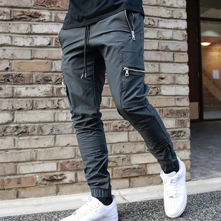 Men's zipper multi-pocket loose fit trousers in black, 95% polyester chemical fiber blend, with belt and small leg opening