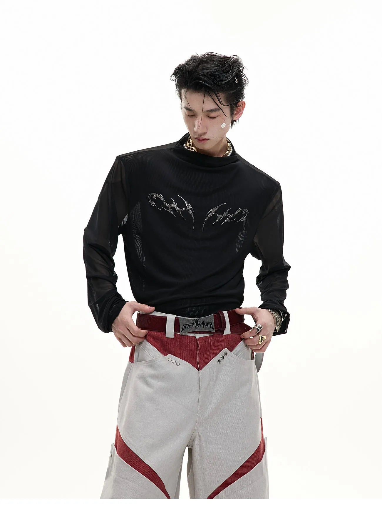 Black mesh slim-fit long sleeve bottoming shirt on a hanger, showing its lightweight texture and close cut.