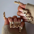 Leopard print butterfly pattern plastic nail art pieces in WM296 colour for manicure decoration