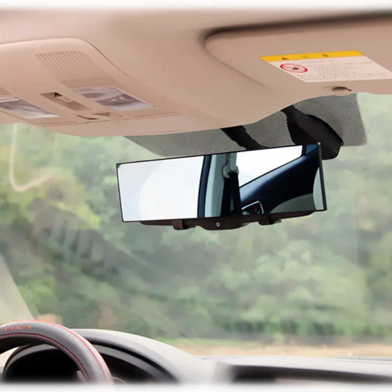Black interior rearview mirror with double curvature glass, 300mm by 70mm, mounted on car windscreen