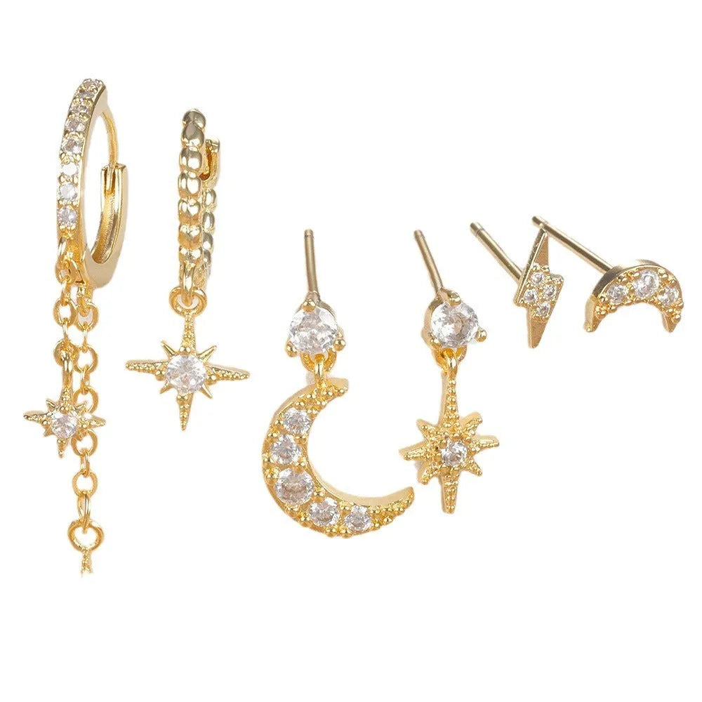 Six gold-coloured chain tassel earrings with zircon stones arranged together