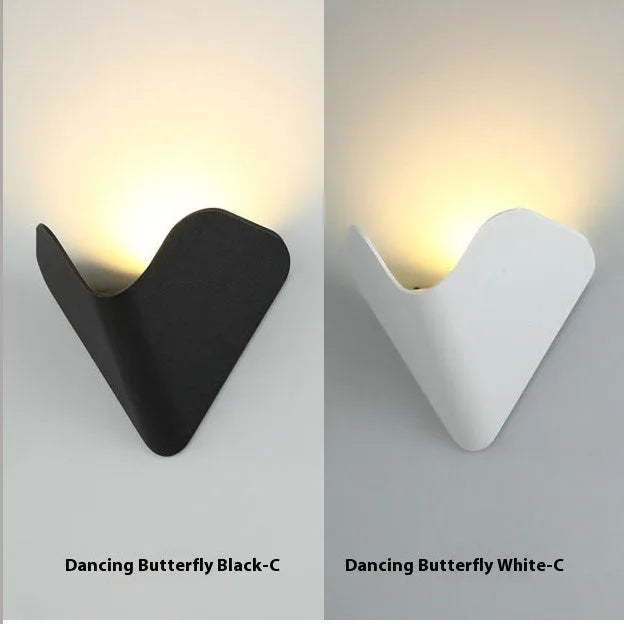 Black bird's nest style aluminium alloy LED lamp with warm white glow.