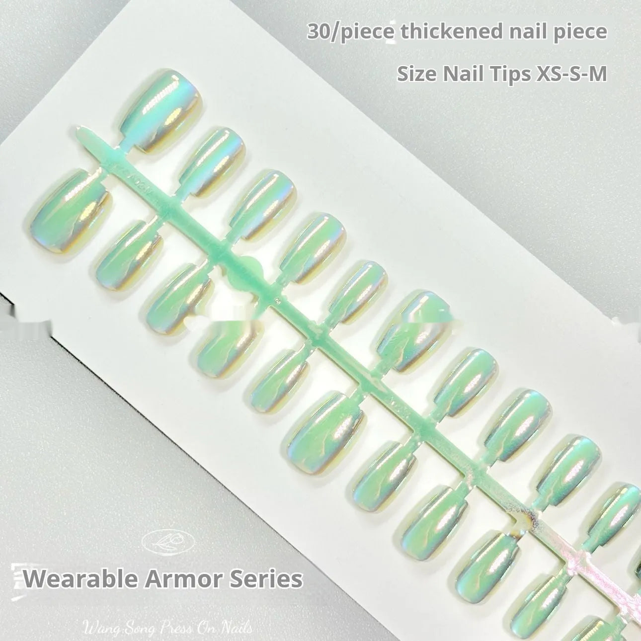 Set of false nails with electroplated cat's eye and aurora design on short ladder shaped tips.