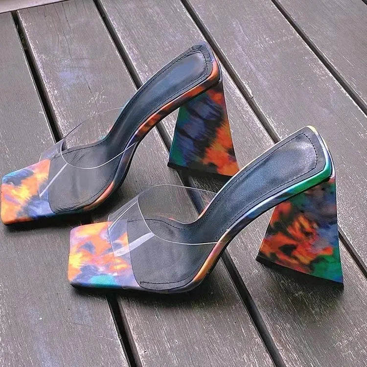 Black women's high heel slippers with square toe and thick triangular rubber sole.