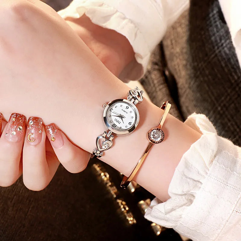 Women's simple rhinestone casual square watch with gold alloy strap and stainless steel buckle on white background
