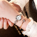 Women's simple rhinestone casual square watch with gold alloy strap and stainless steel buckle on white background