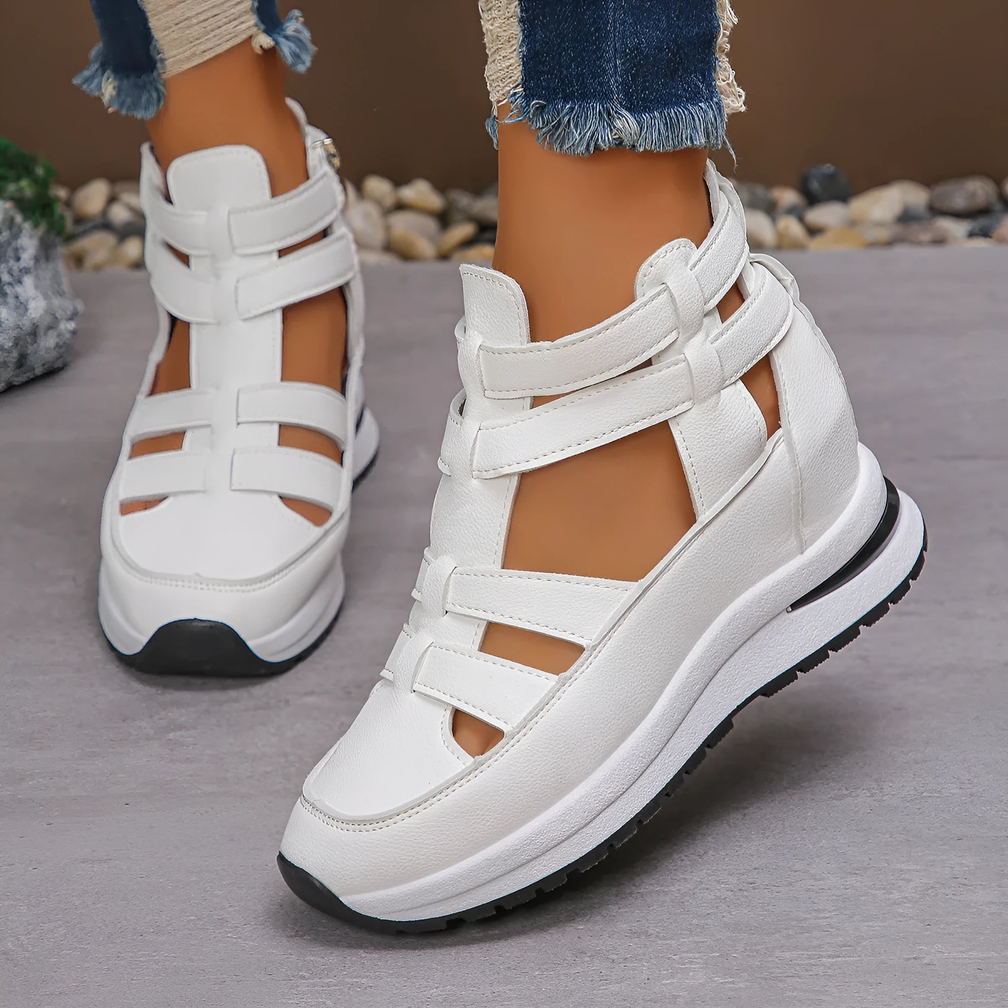 Black women's platform sandals with closed toe, hollow-out design and Velcro strap.