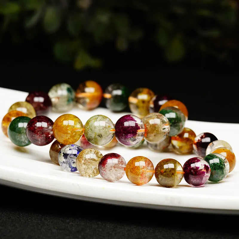 Crystal bracelet with 10mm beads showing a colourful natural four seasons ghost cornucopia ethnic design.