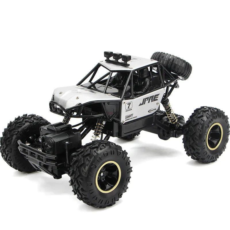 Large black 4WD remote control off-road climbing car on rough ground