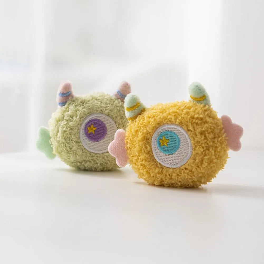 Cartoon plush dog chew toy with big eyes and squeaky sound feature.