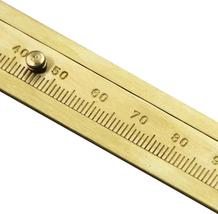 Double scale mini copper caliper 100mm brass vernier caliper with metric and imperial scales on white background