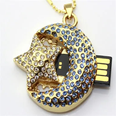 Silver metal Jewelry Xingyue USB flash drive with retractable connector on a plain background.