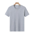 A loose-fit, thick cotton T-shirt in a solid colour, shown on a hanger.