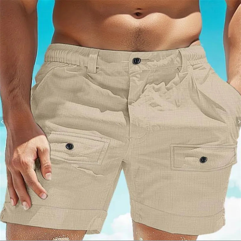 Men's linen shorts in khaki with elastic waistband and button pockets laid flat.