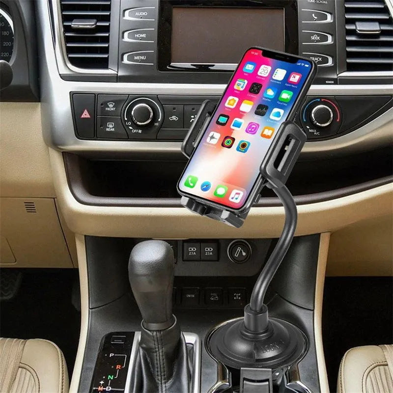 Black universal car phone mount holder with adjustable side grips, shown mounted on a car air vent.