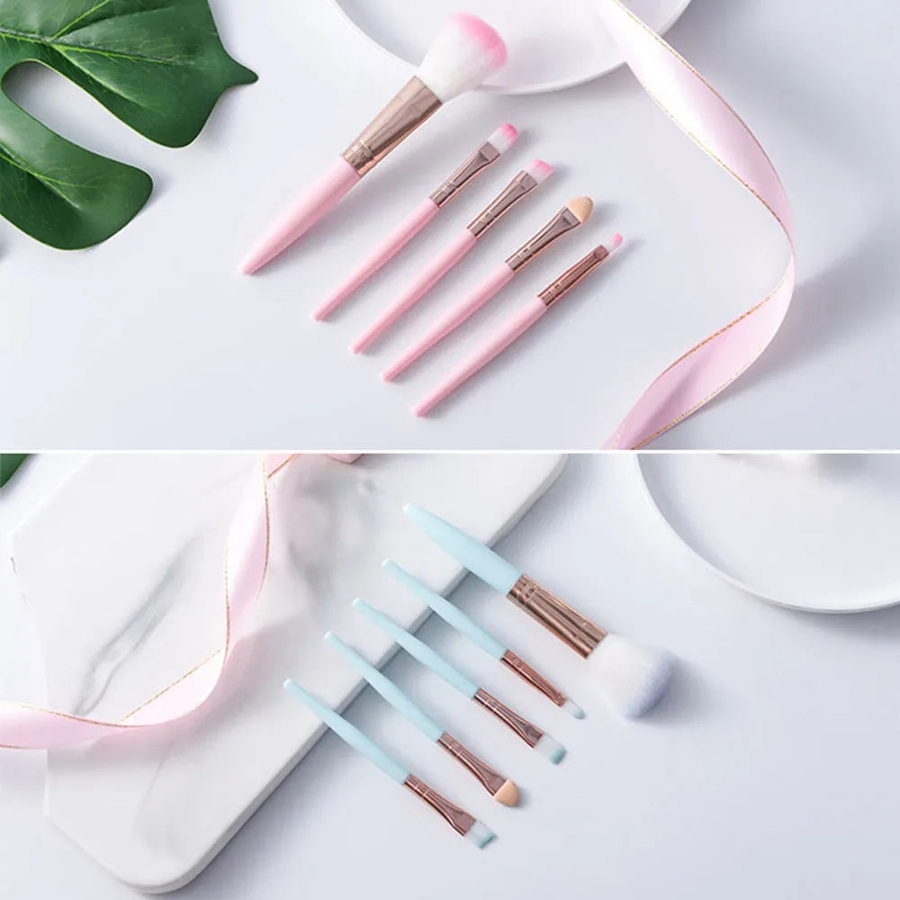 Five mini makeup brushes with short plastic handles, man-made fibre bristles, 8.5cm total length, blue and pink colours
