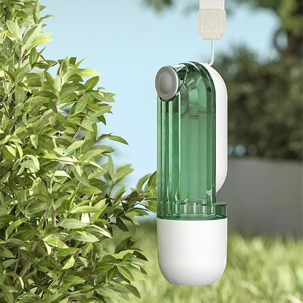 Foldable dog water bottle with food dispenser in beige or green colours for outdoor walking and hiking