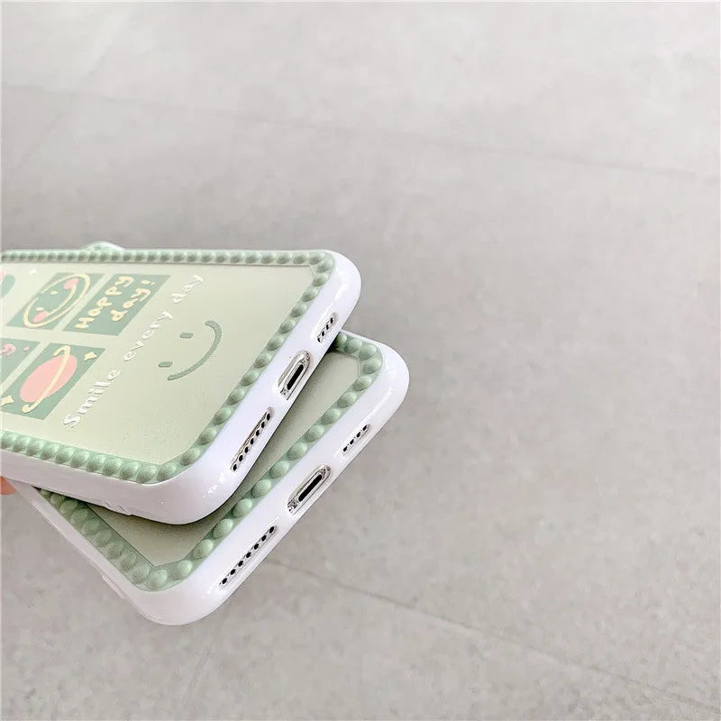 Green TPU phone case with geometric smiley face and polka dot pattern for multiple iPhone models.