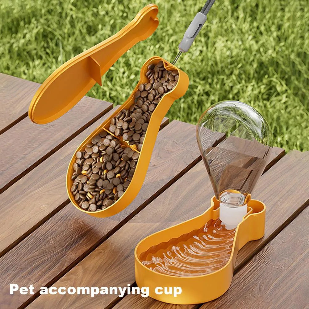 Orange and white portable pet water feeder bottle with attached food container for dogs and cats.