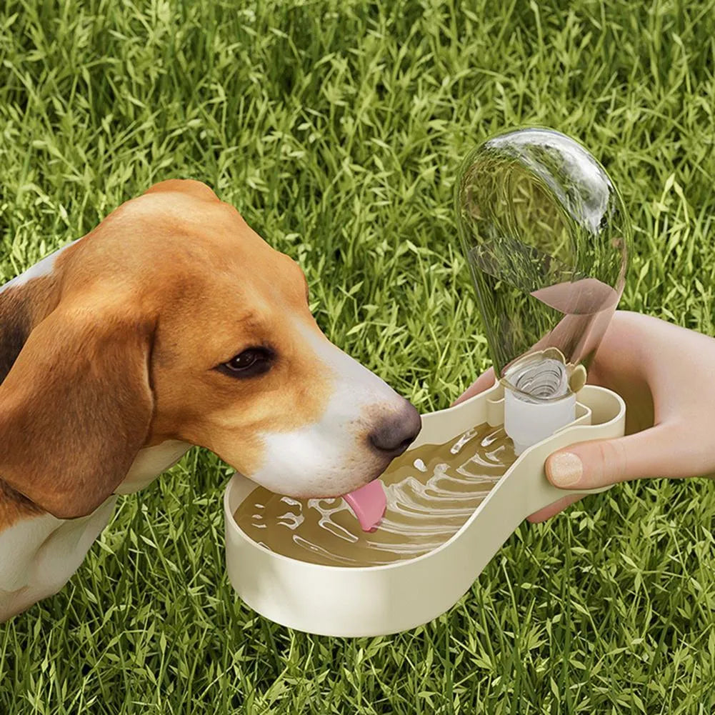 Orange and white portable pet water feeder bottle with attached food container for dogs and cats.