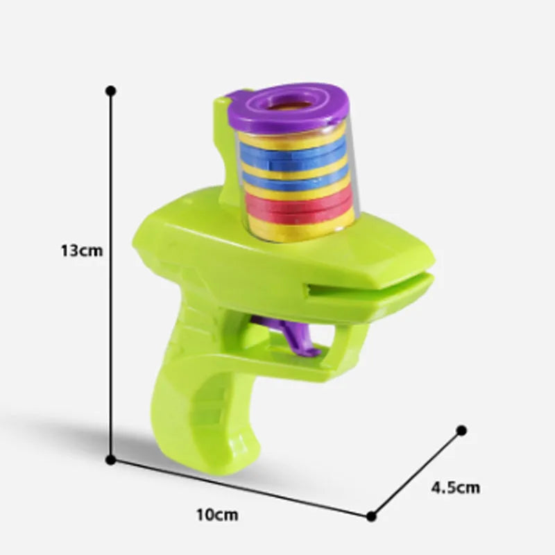 Green and purple battery-free interactive cat toy launcher with soft foam discs on a plain background