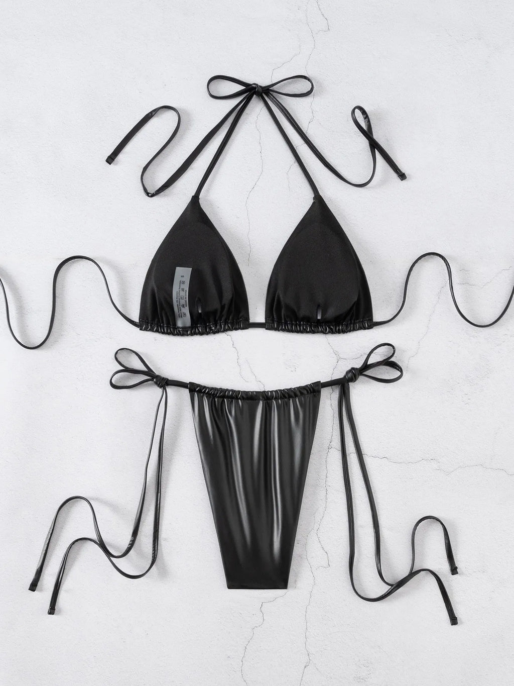 Black solid colour split bikini set for women with polyester-spandex fabric, brief style bottom, sleeveless top, sizes S M L
