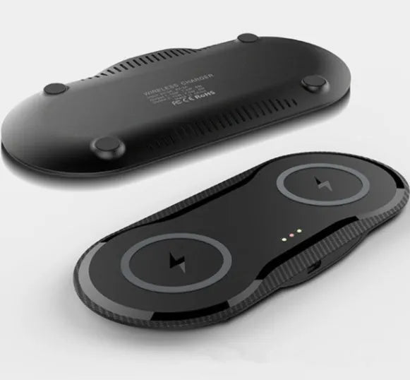 Black dual-base wireless charger charging two smartphones simultaneously on desk