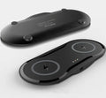 Black dual-base wireless charger charging two smartphones simultaneously on desk