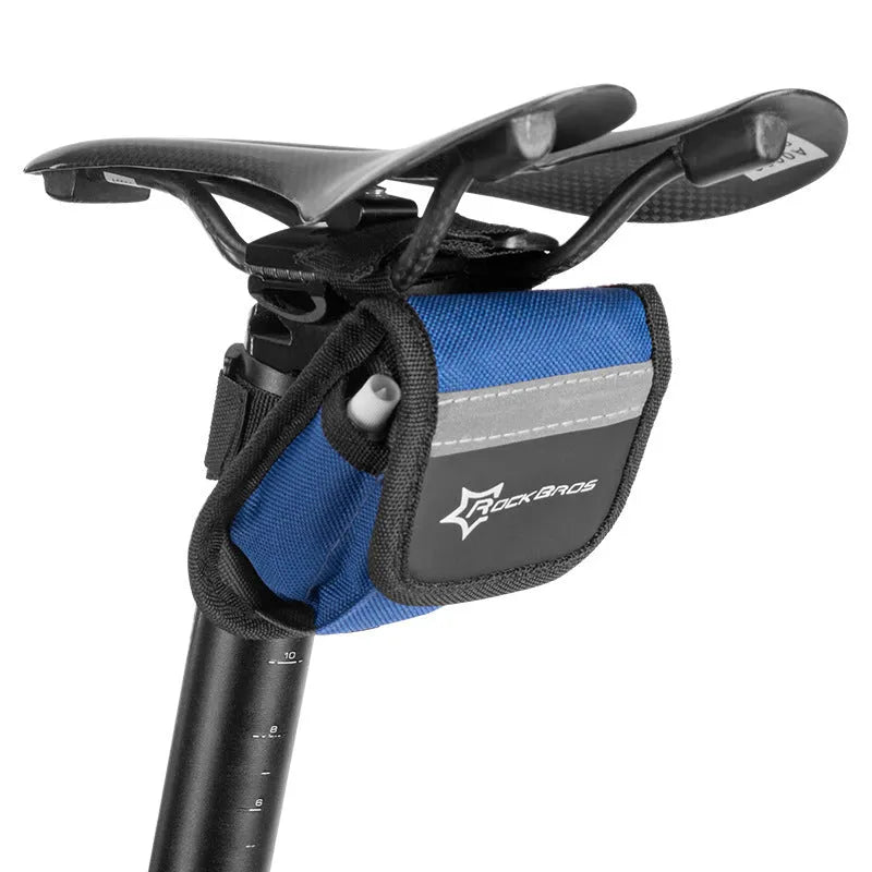 Bicycle tire repair kit in frame-mounted bag on bike upper tube with multicolour design