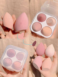 Four coloured synthetic makeup sponge eggs in grape, mango, mint and peach peach