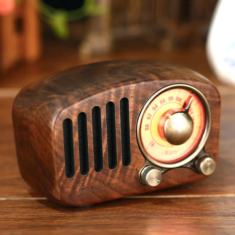 Retro wooden mini Bluetooth speaker in cherry or walnut finish showing compact size