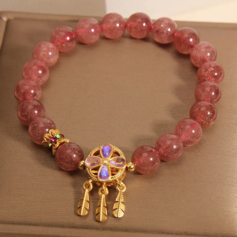 Women's crystal bracelet with strawberry quartz four-leaf dream catcher ball pendant