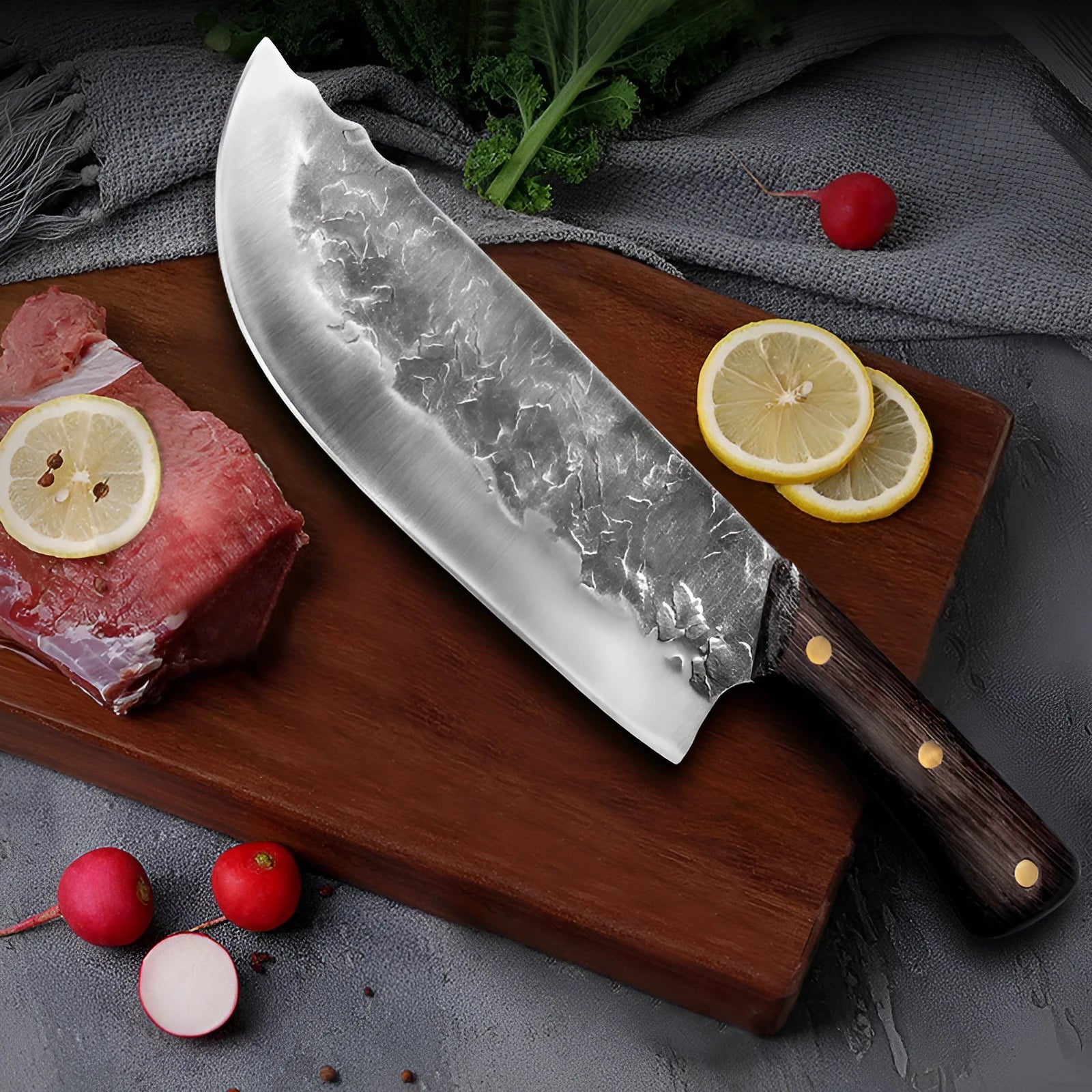 Hand forged stainless steel butcher knife with chicken wing wood handle and copper nails on a cutting board