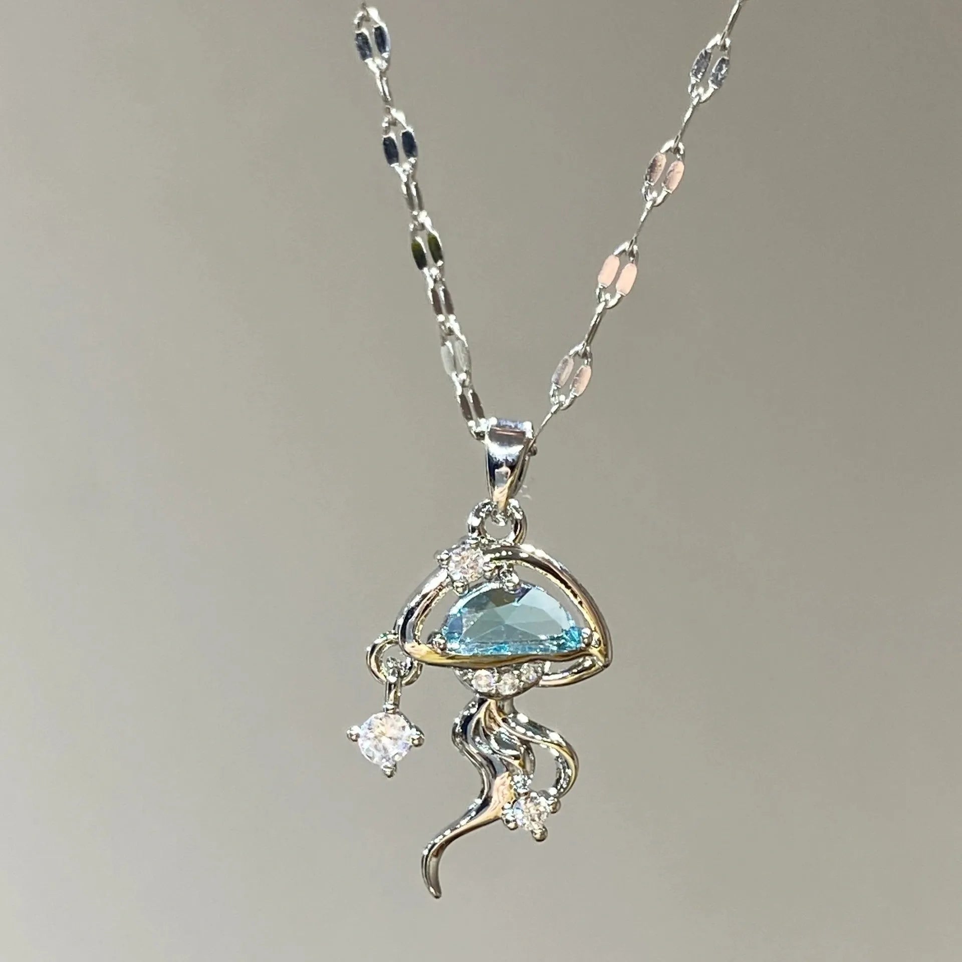 Blue jellyfish charm on sterling silver necklace with adjustable chain