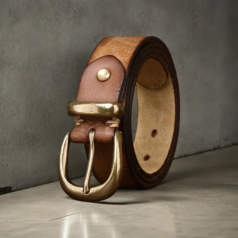 Men's black genuine leather casual belt with a copper pin buckle, showing length adjustment holes.