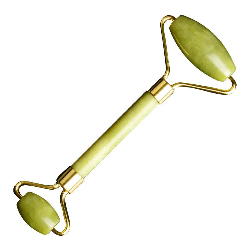 Natural Xiuyu jade double-end roller with green stone, hand-polished finish, large and small wheels on a flat surface