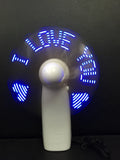 White handheld mini fan displaying a red flashing 'I Love You' LED pattern on its front panel.