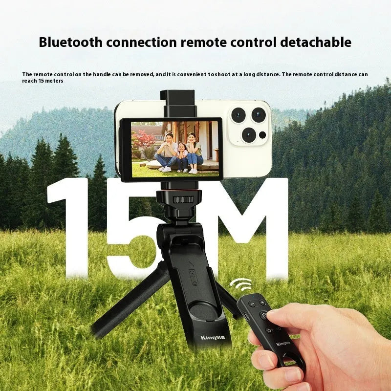 Mobile phone Bluetooth remote control tripod with handle in black ABS material on flat surface