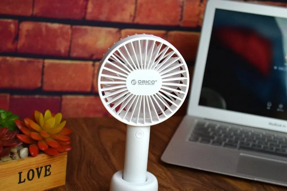 White ORICO FH1 portable USB rechargeable small fan on a desk