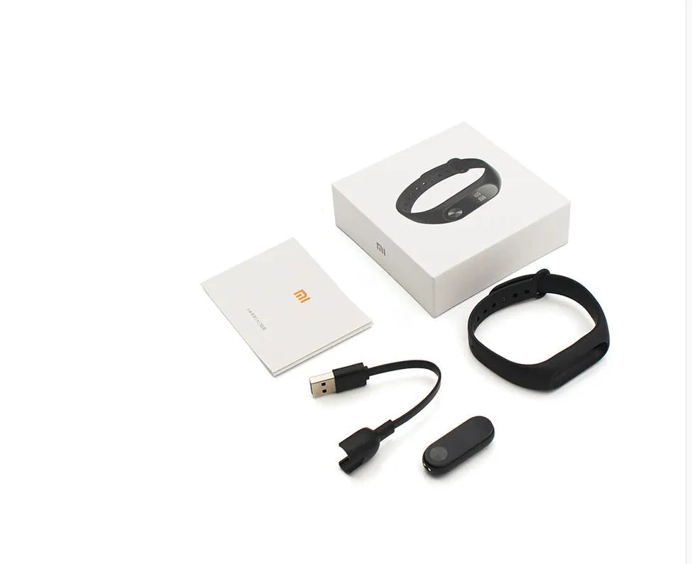 Xiaomi Mi Band 2 black fitness band with OLED screen on an adjustable wrist strap.