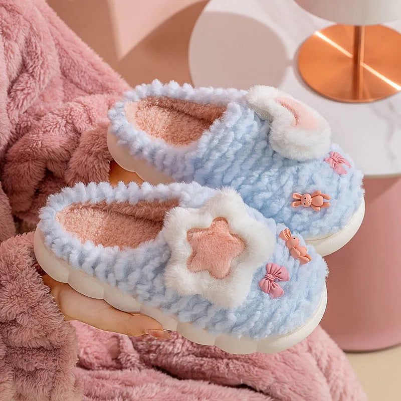 Women's light blue cartoon fleece-lined plush slippers with floral pattern and round toe.