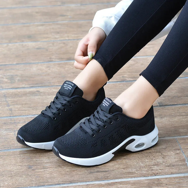 Women's flying woven mesh lace-up casual shoes with rubber sole, flat heel, and breathable upper, sizes 35-42.
