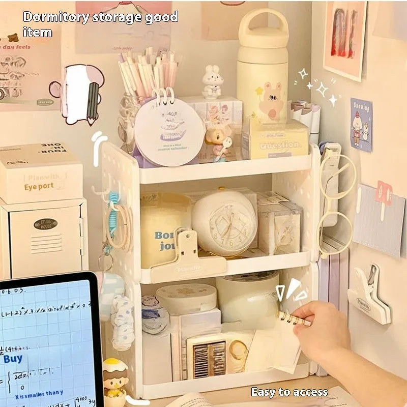 Beige plastic desktop wire-wrap board storage rack with three layers, two pen containers, and six hooks on a desk