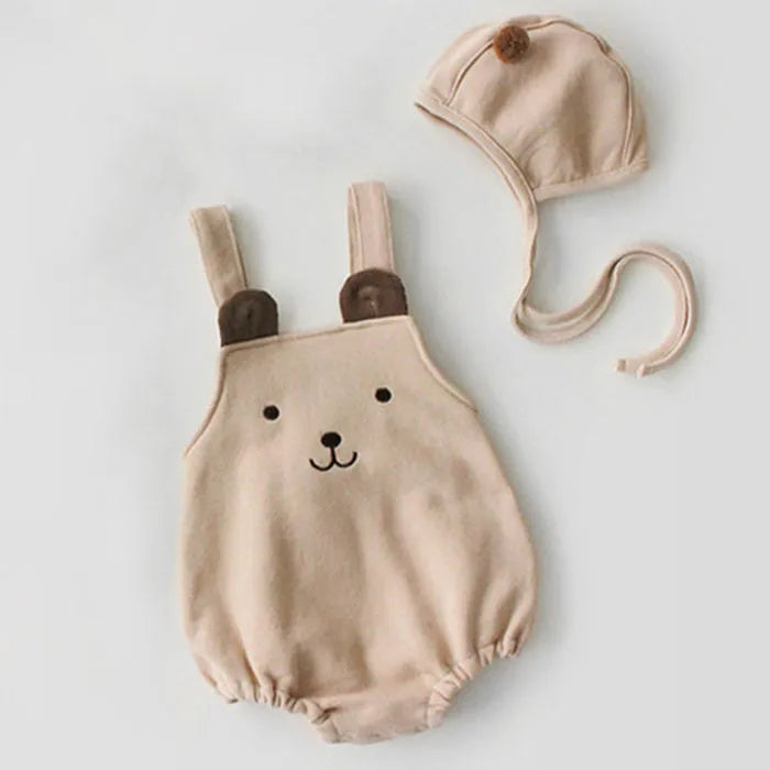 Baby sleeveless strapless cotton robe with detachable hood in brown or white on a plain background