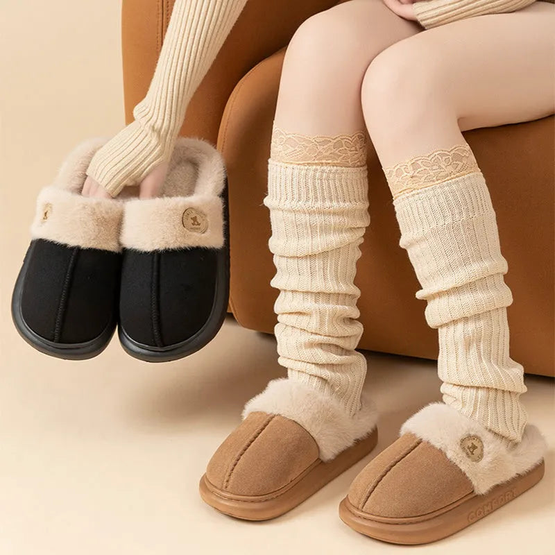 Pair of thick-soled plush fleece slippers for indoor winter wear, shown in a selected colour.